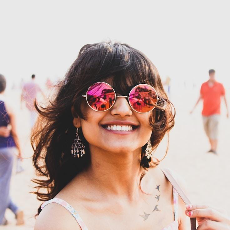 Kaveri Mehta, Lead Design Curator at Cobalt Linen Haven, reviewing corporate floral arrangements